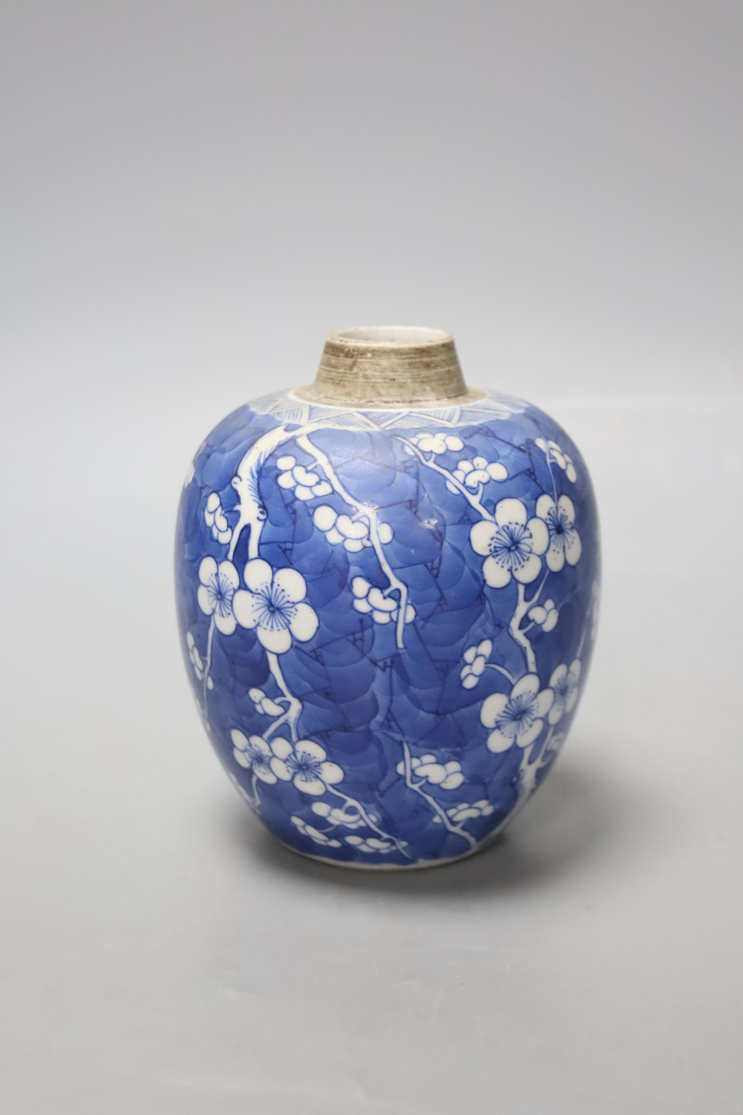 A Chinese Kangxi blue and white prunus jar, lacking cover, height 12cm